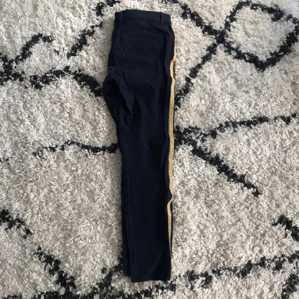 Navy blue pants with gold stripe